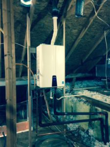 tankeless hot water heater in an attic