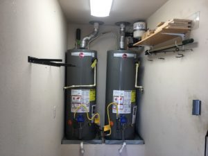two hot water heaters beside each other